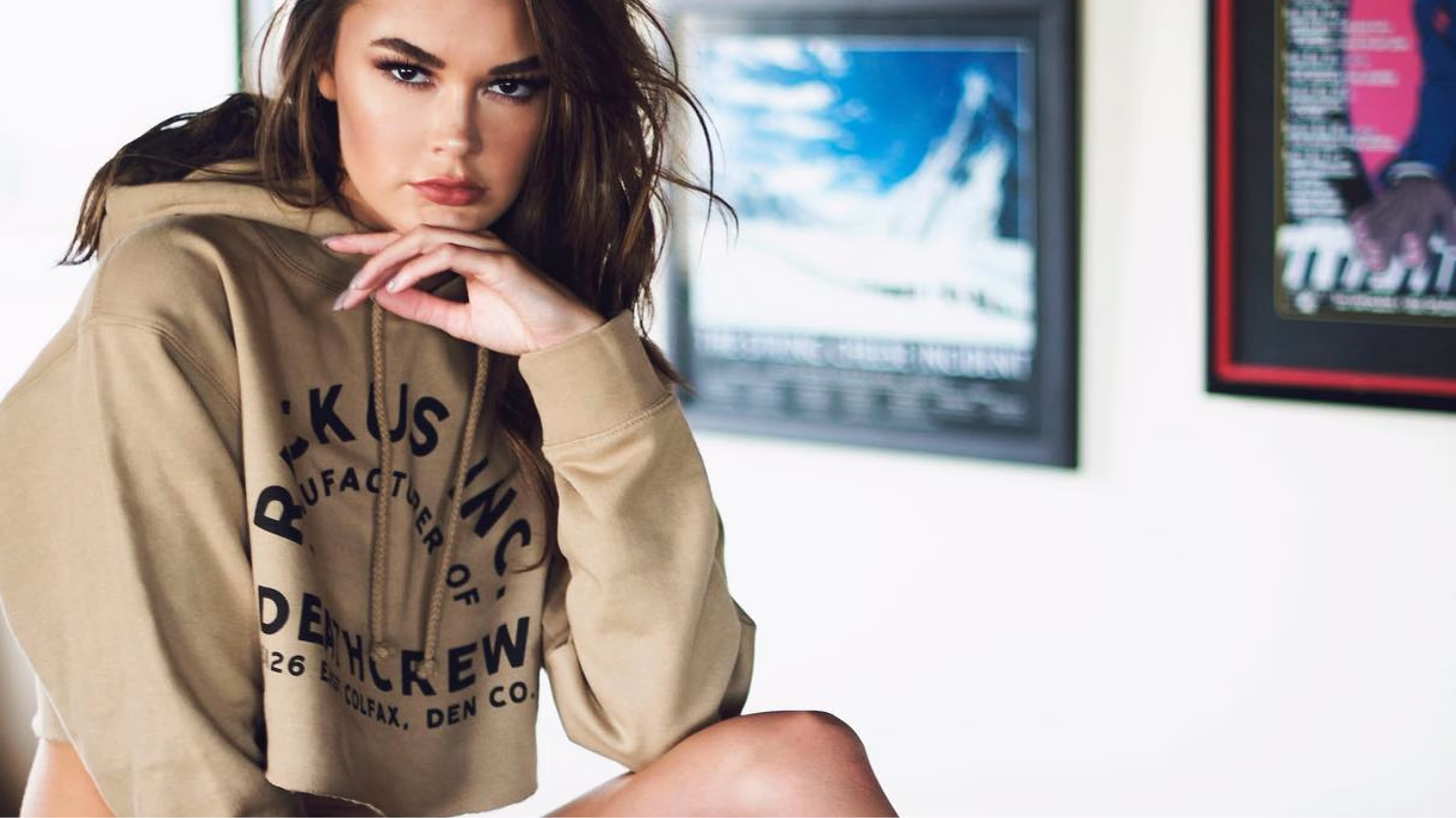 Model wearing a tan Ruckus graphic T-shirt