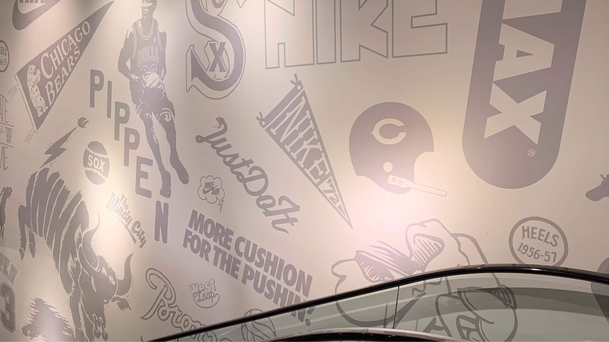 Close-up of the Nike Chicago mural with lettering and sports illustrations