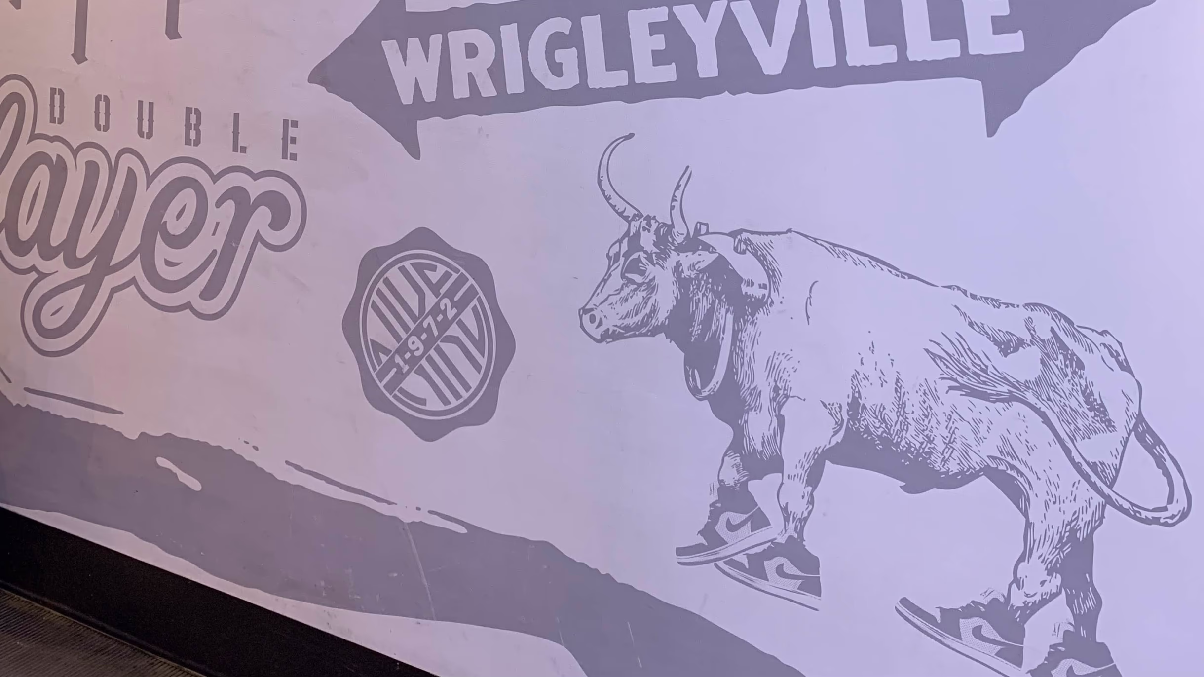 Wrigleyville lettering and bull illustration in the Nike Chicago mural