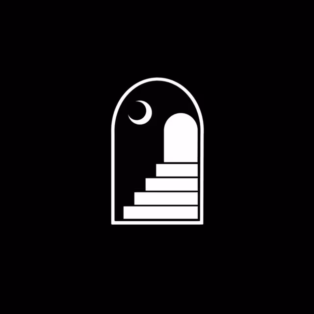 White arched doorway with a crescent moon and staircase on black