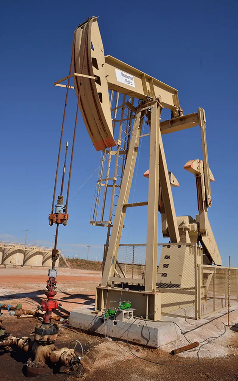 Angled close-up of an oil pumping unit
