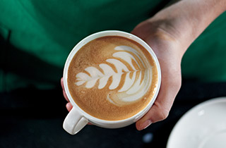 Close-up of latte art in a Starbucks coffee cup