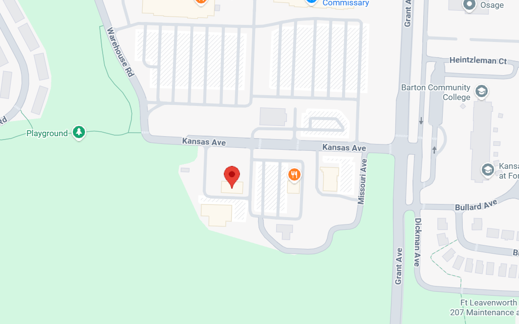 Map showing Kansas Ave and nearby streets including Warehouse Rd, Missouri Ave, and Grant Ave near Barton Community College and a playground.