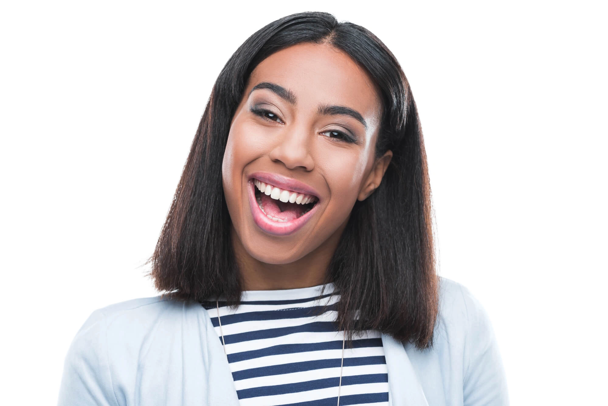 Smiling young woman with straight dark hair wearing a striped shirt and light jacket.