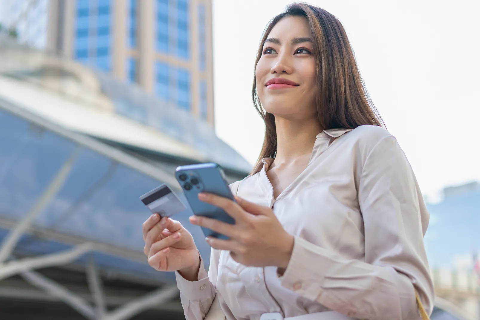 woman looking at phone smiling