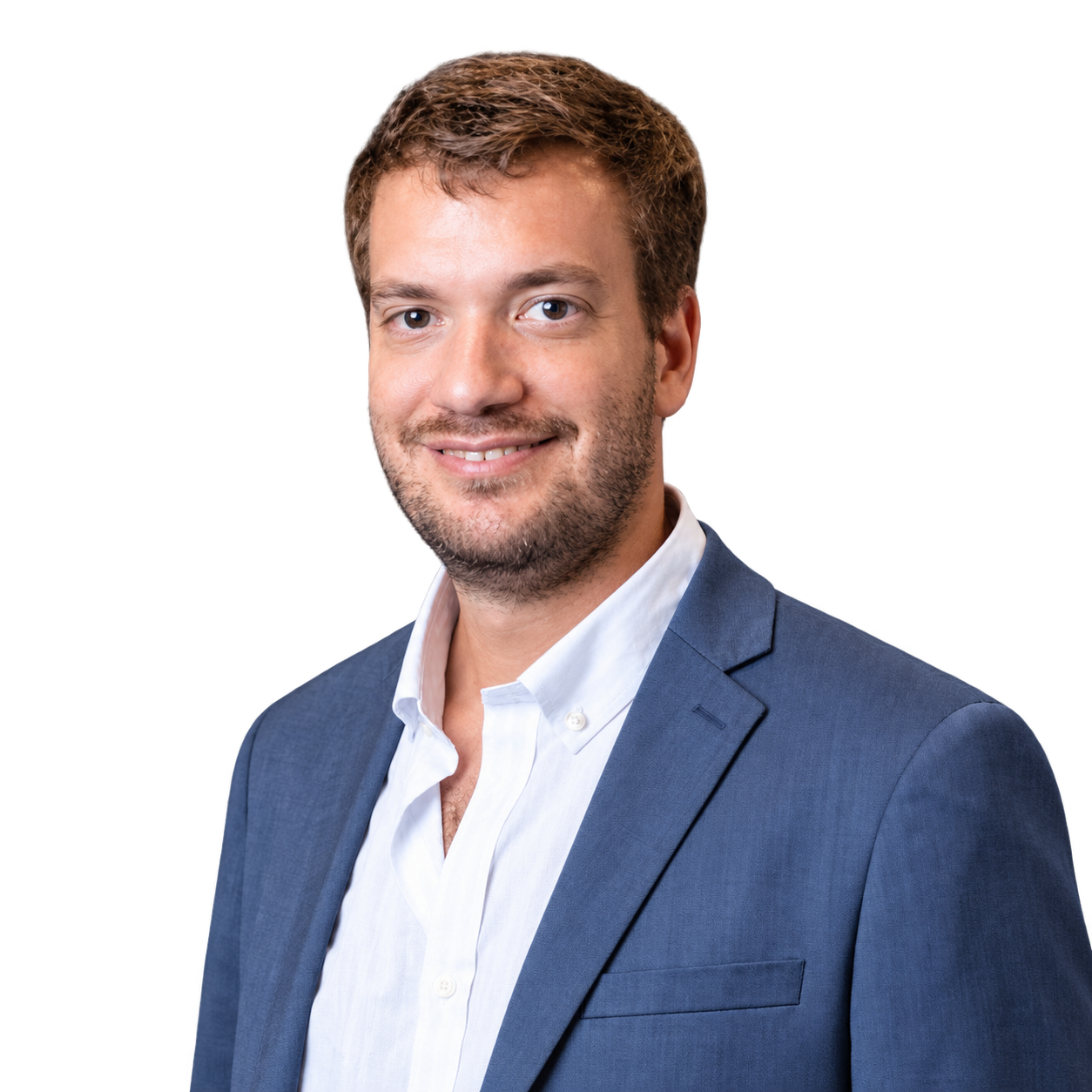 Javier Schandy smiling in a blue suit jacket