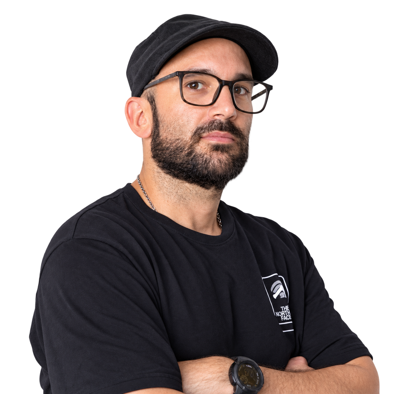 Pablo Grill with arms crossed, wearing glasses, a black cap, and a black T-shirt.