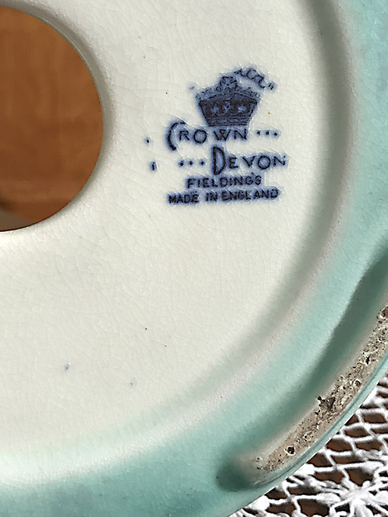 Blue Crown Devon Fieldings maker's mark stamped on the bottom of a ceramic piece.