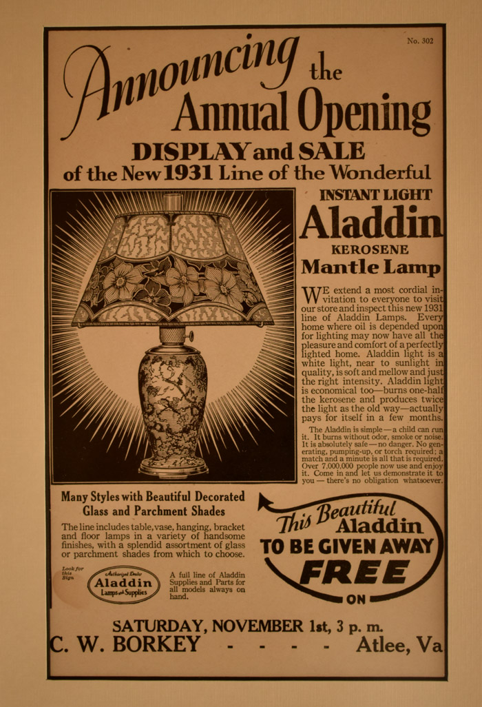 1931 advertisement for Aladdin kerosene mantle lamp with decorated glass and parchment shades.