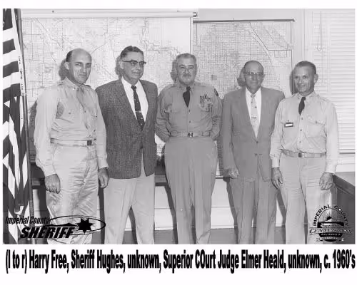 Five men, including Sheriff Hughes and Superior Court Judge Elmer Heald, standing in front of a large map, circa 1960s.
