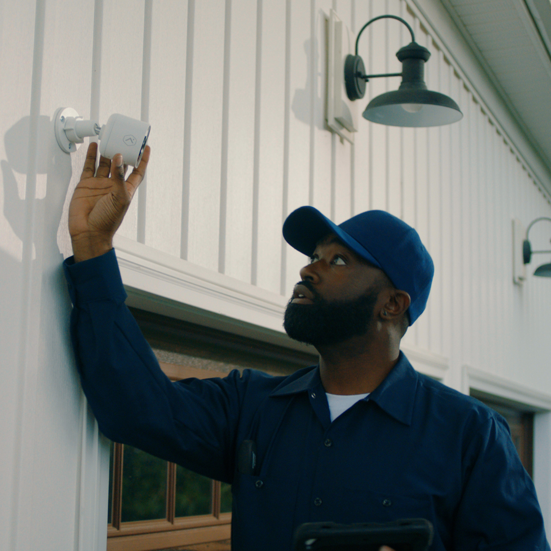 Exterior porch light on a Texas home, representing local, personal VGI Technology service