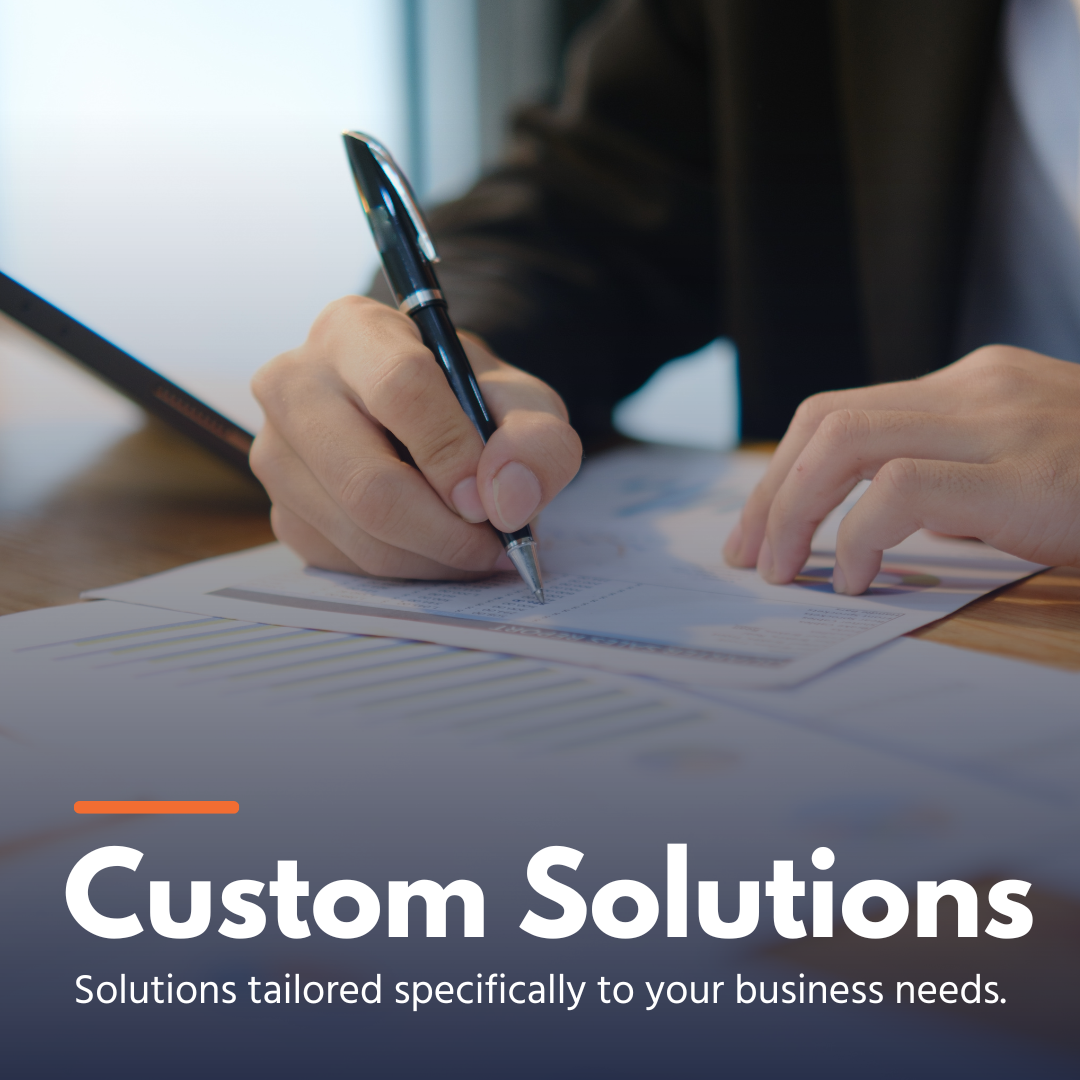 Person writing on business documents with pen, emphasizing custom business solutions.