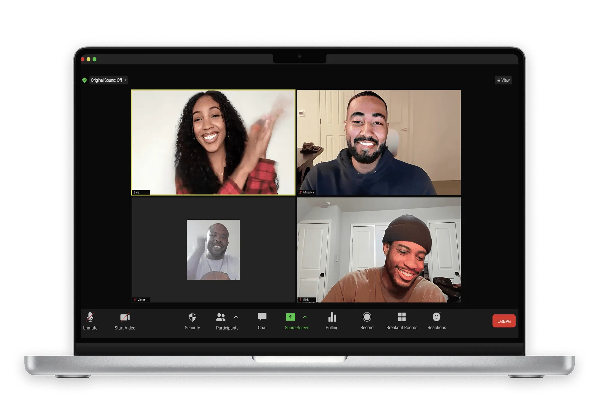 MacBook Pro laptop displaying a four-person zoom video conference call with smiling participants.