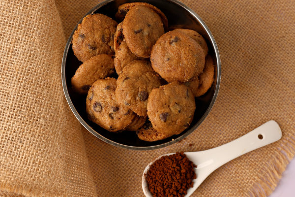 Stack of chocolate chip cookies tied together with a white string bow.