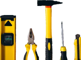 Close-up of yellow and black tools including a level, pliers, hammer, and screwdrivers.
