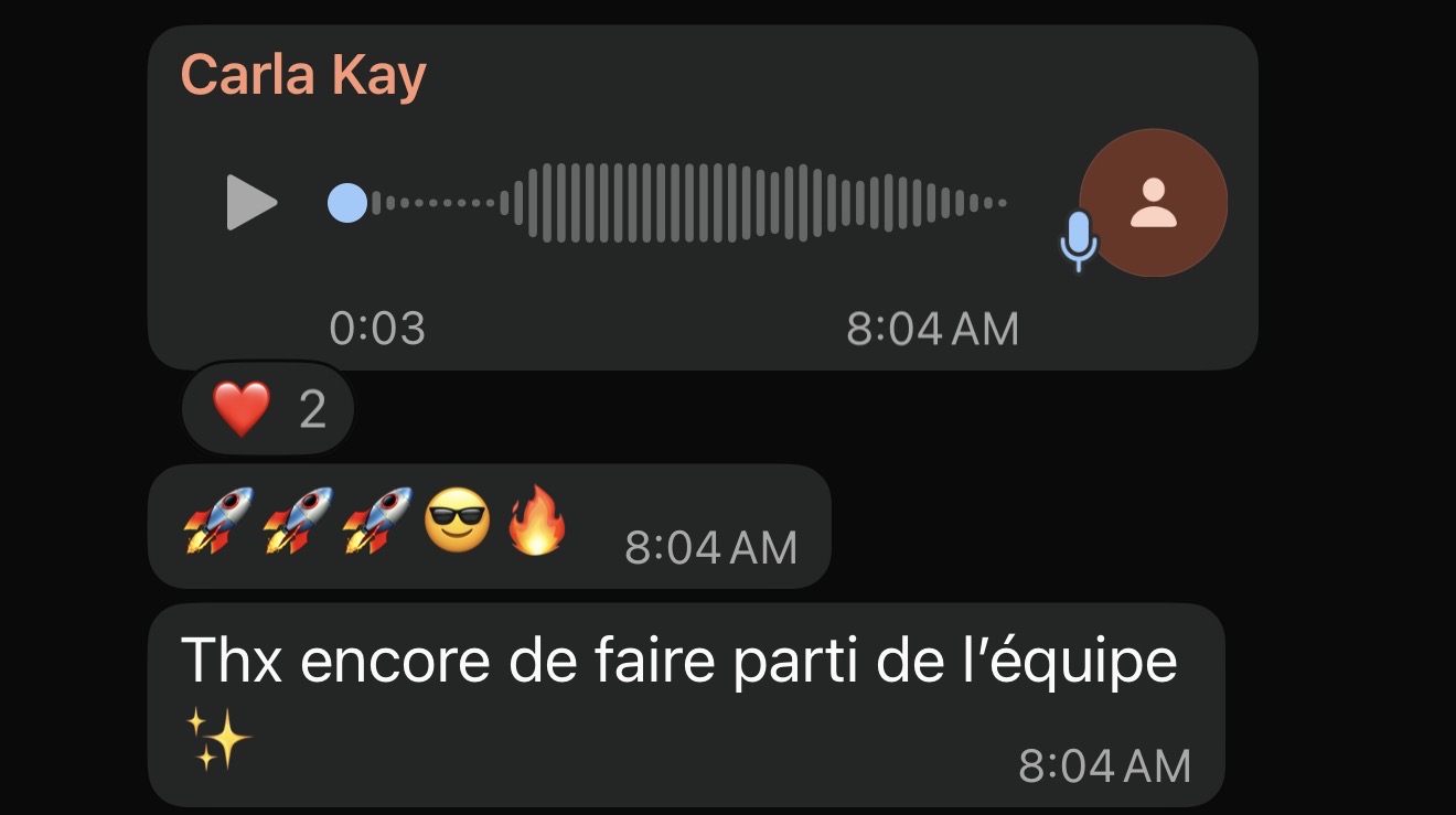 Audio message from Carla Kay with a waveform, timestamp 8:04 AM, followed by chat responses including two heart emojis, three rocket emojis with sunglasses and fire emojis, and text thanking for being part of the team in French.
