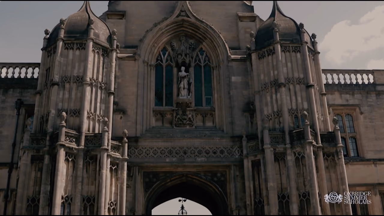 Close-up view of a historic stone clock tower with gothic architectural details.