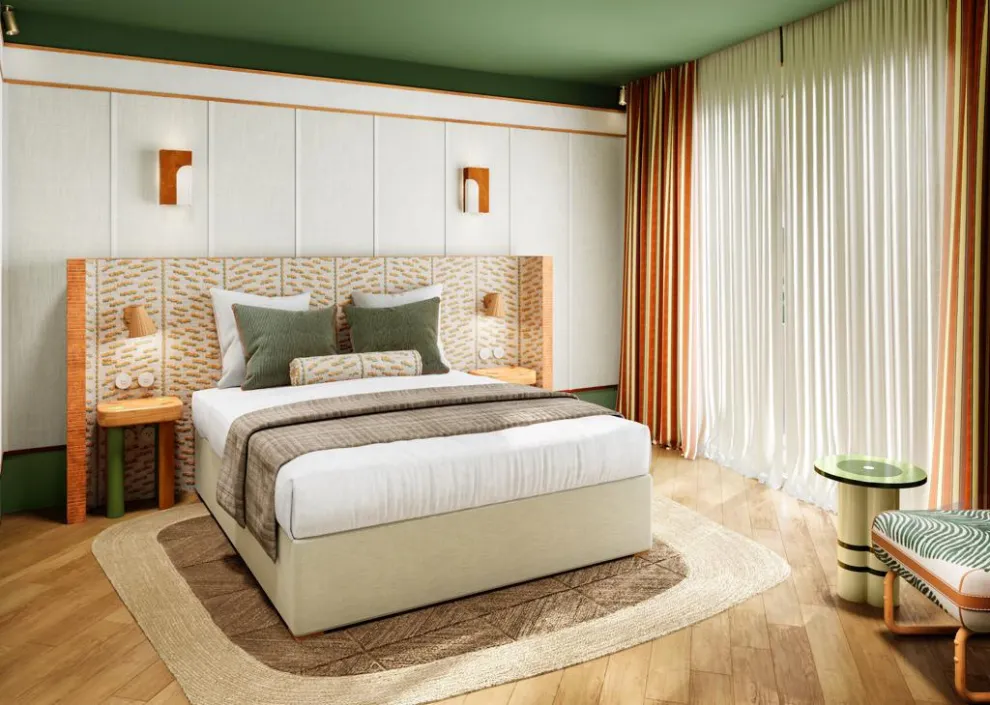 Style épuré aux Cimes Bleues : lit king-size, design graphique et plafond vert pour vos chambres et suites d'hôtel au bord de mer et hôtel spa.