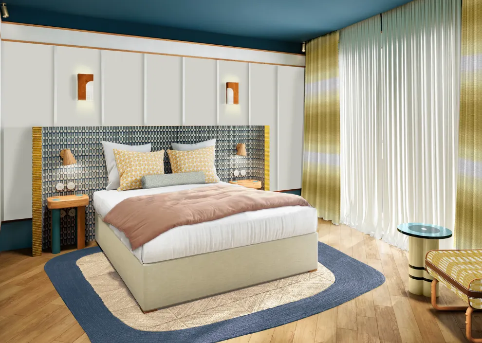 Style azur aux Cimes Bleues : lit king-size, tête de lit en mosaïque et plafond bleu dans les chambres et suites de votre hôtel au bord de mer et hôtel spa.