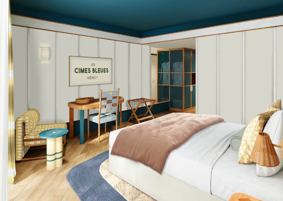 Esprit Riviera aux Cimes Bleues : plafond bleu pétrole, mobilier en rotin et bureau design dans les chambres et suites de votre hôtel au bord de mer et hôtel spa.