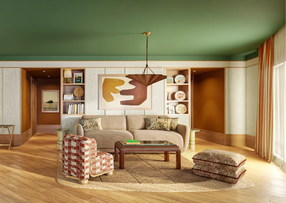 L'élégance du salon d'une suite aux Cimes Bleues : plafond vert, mobilier rétro et design soigné au sein de votre hôtel au bord de mer et hôtel spa.