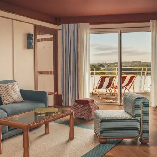 Living room of the Deluxe Terrace suite at Les Cimes Bleues seaside hotel.