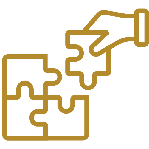 Hand fügt ein Puzzleteil in ein fast komplettes Puzzle ein.