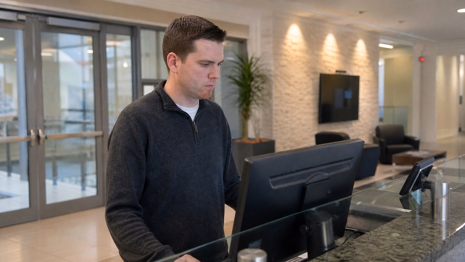 RECEPTION AREA An IT professional one person standing at a front reception d