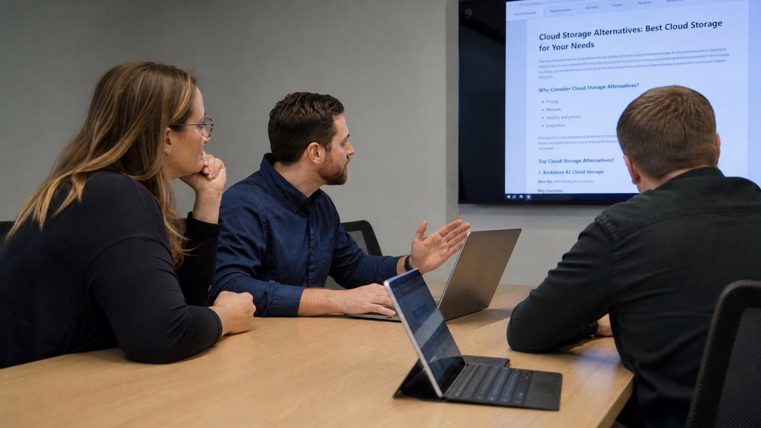 MEETING TABLE An IT professional two to four people seated around a meeting