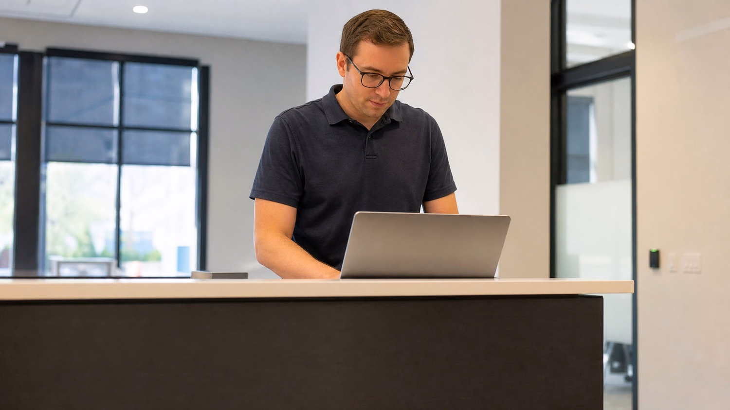 RECEPTION AREA An IT professional one person standing at a front reception d