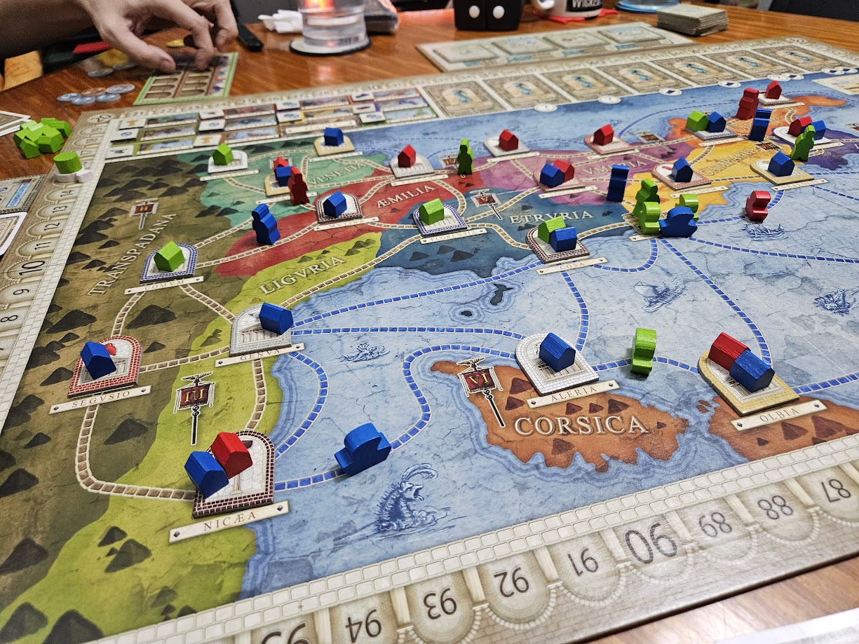 Gameplay photo of the board game Concordia featuring various components and board state.