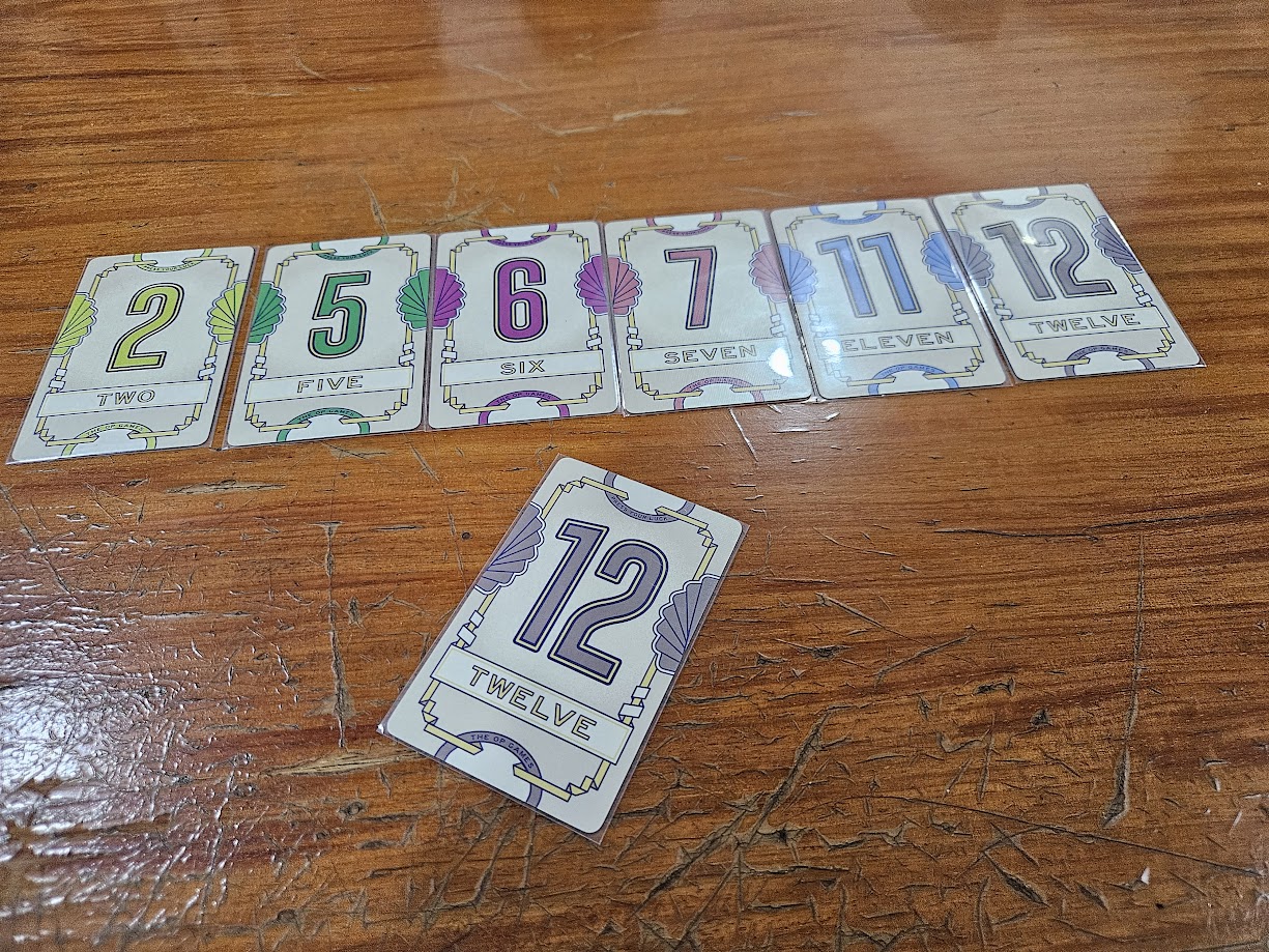 Gameplay photo of the board game Flip 7 featuring various components and board state.