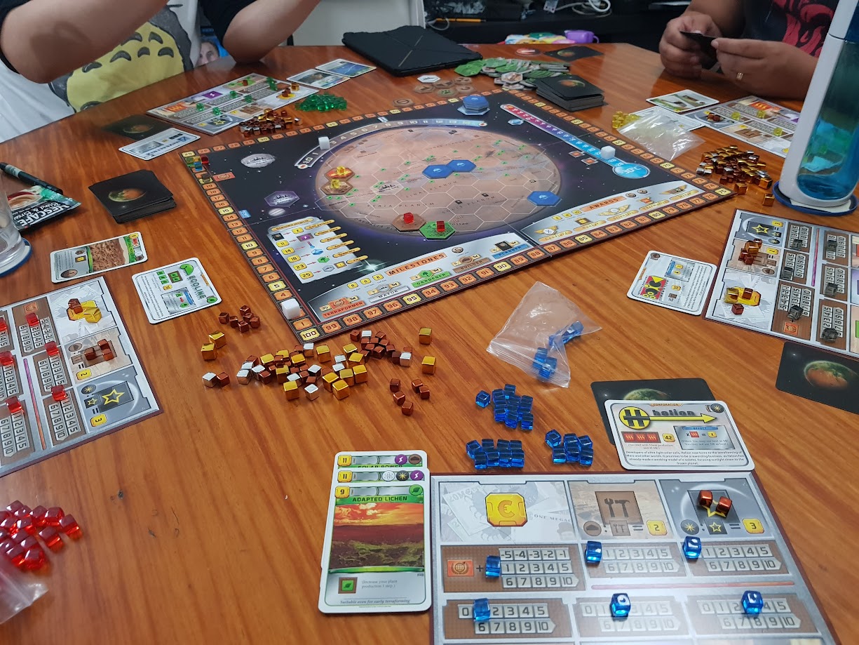 Gameplay photo of the board game Terraforming Mars featuring various components and board state.