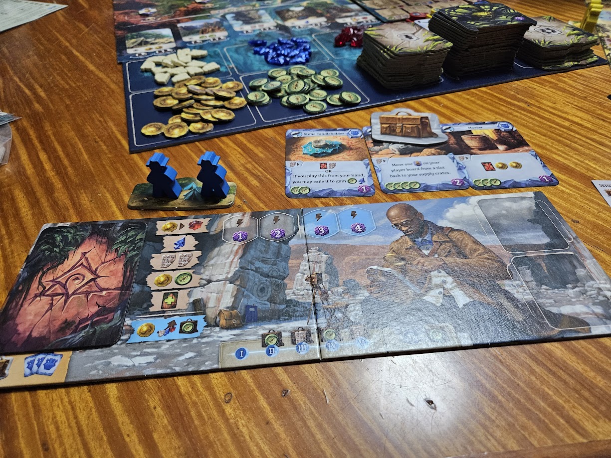 Gameplay photo of the board game Lost Ruins of Arnak: Expedition Leaders featuring various components and board state.