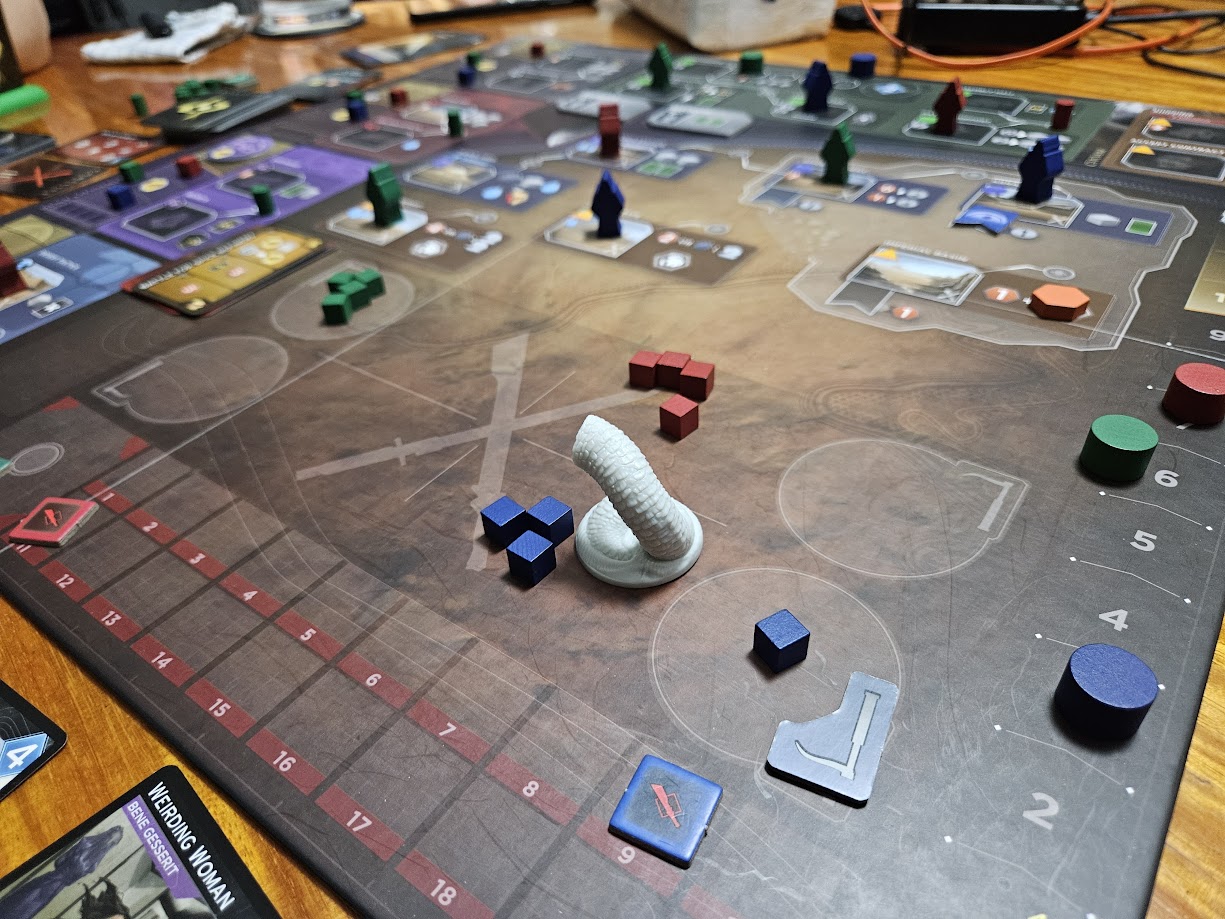 Gameplay photo of the board game Dune: Imperium – Uprising featuring various components and board state.