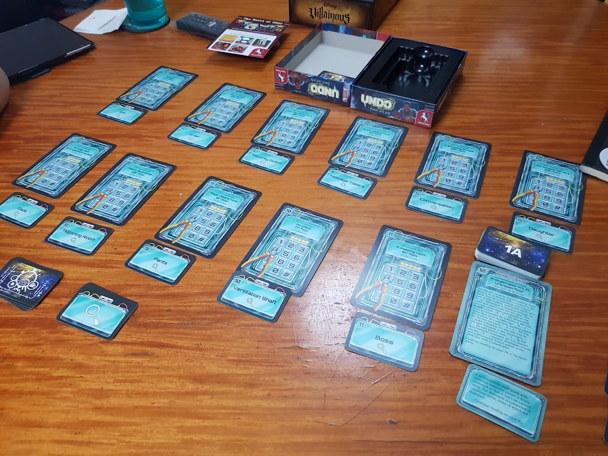 Gameplay photo of the board game UNDO: 600 Seconds featuring various components and board state.