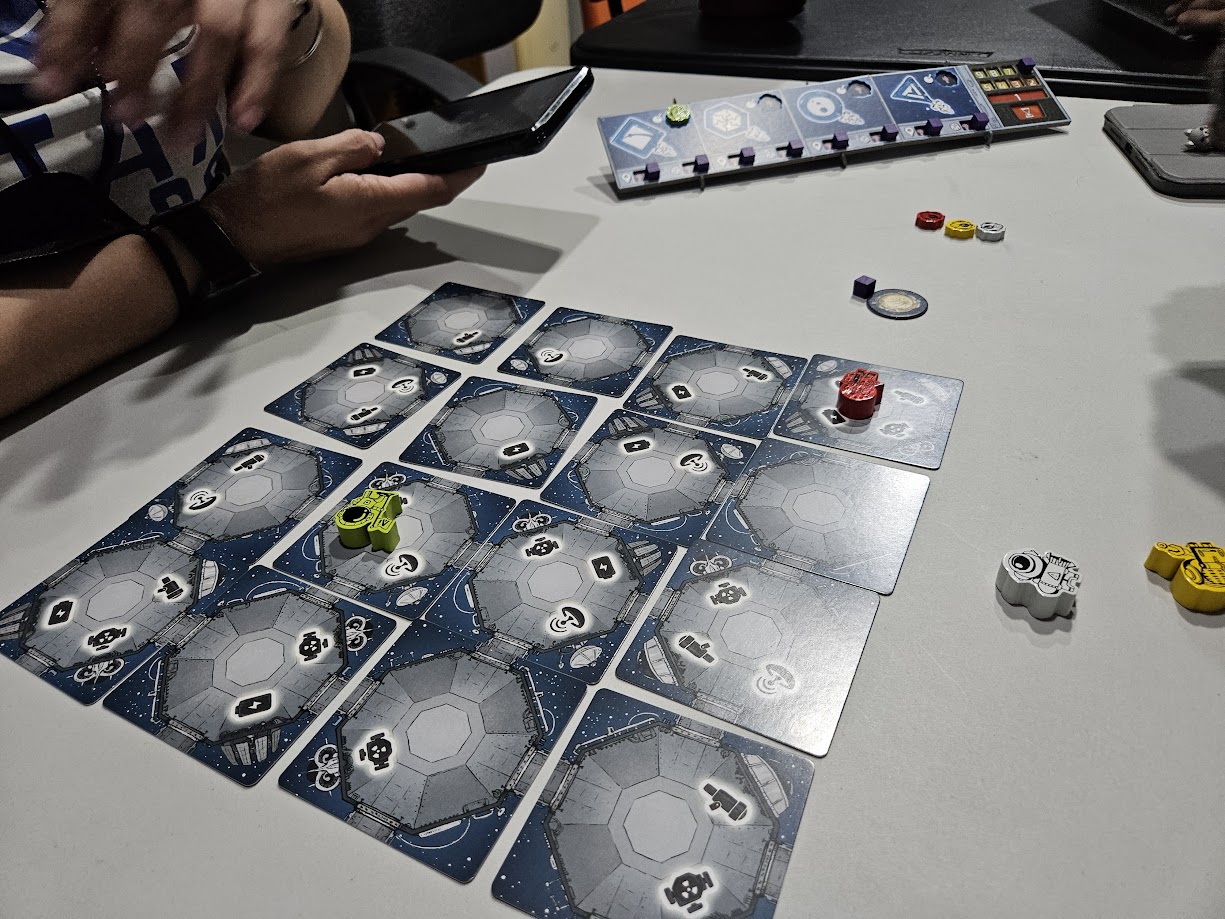 Gameplay photo of the board game AI Space Puzzle featuring various components and board state.