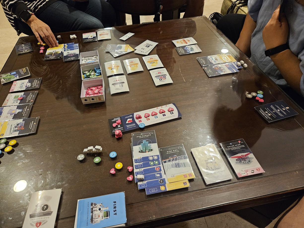Gameplay photo of the board game Moon featuring various components and board state.