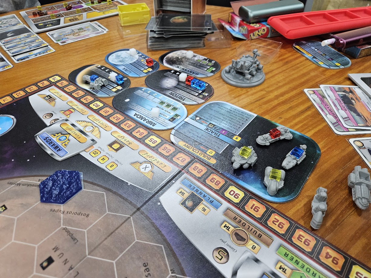 Gameplay photo of the board game Terraforming Mars: Colonies featuring various components and board state.