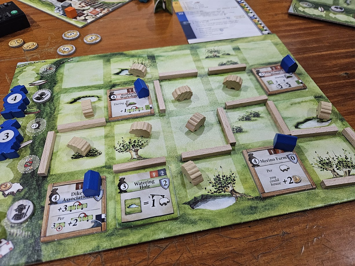 Gameplay photo of the board game Lowlands featuring various components and board state.