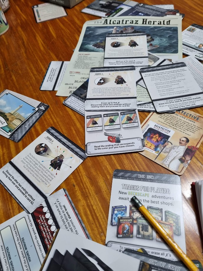 Gameplay photo of the board game Deckscape: Escape from Alcatraz featuring various components and board state.
