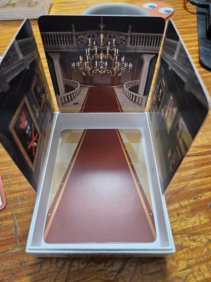 Gameplay photo of the board game Decktective: The Gaze of the Ghost featuring various components and board state.