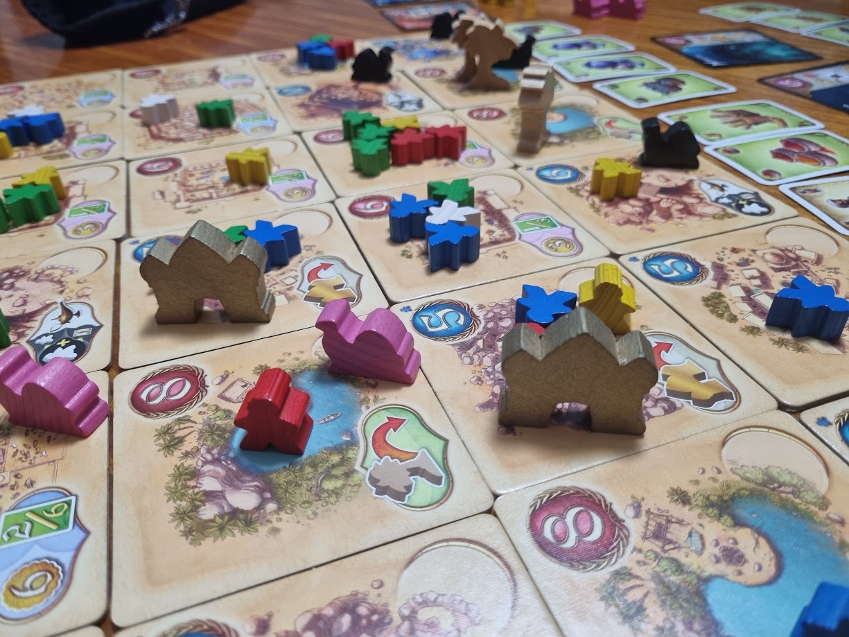 Gameplay photo of the board game Five Tribes: The Djinns of Naqala featuring various components and board state.
