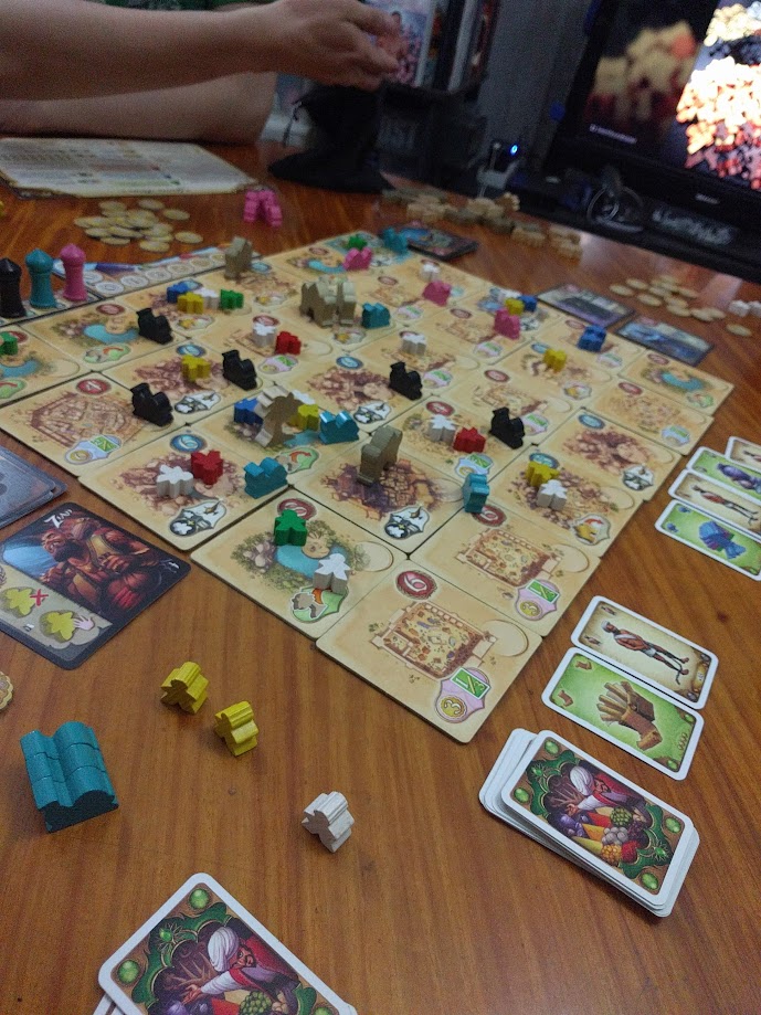 Gameplay photo of the board game Five Tribes: The Thieves of Naqala featuring various components and board state.