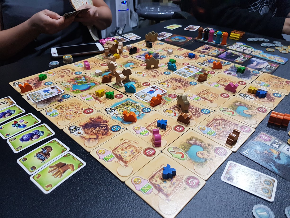 Gameplay photo of the board game Five Tribes: Whims of the Sultan featuring various components and board state.