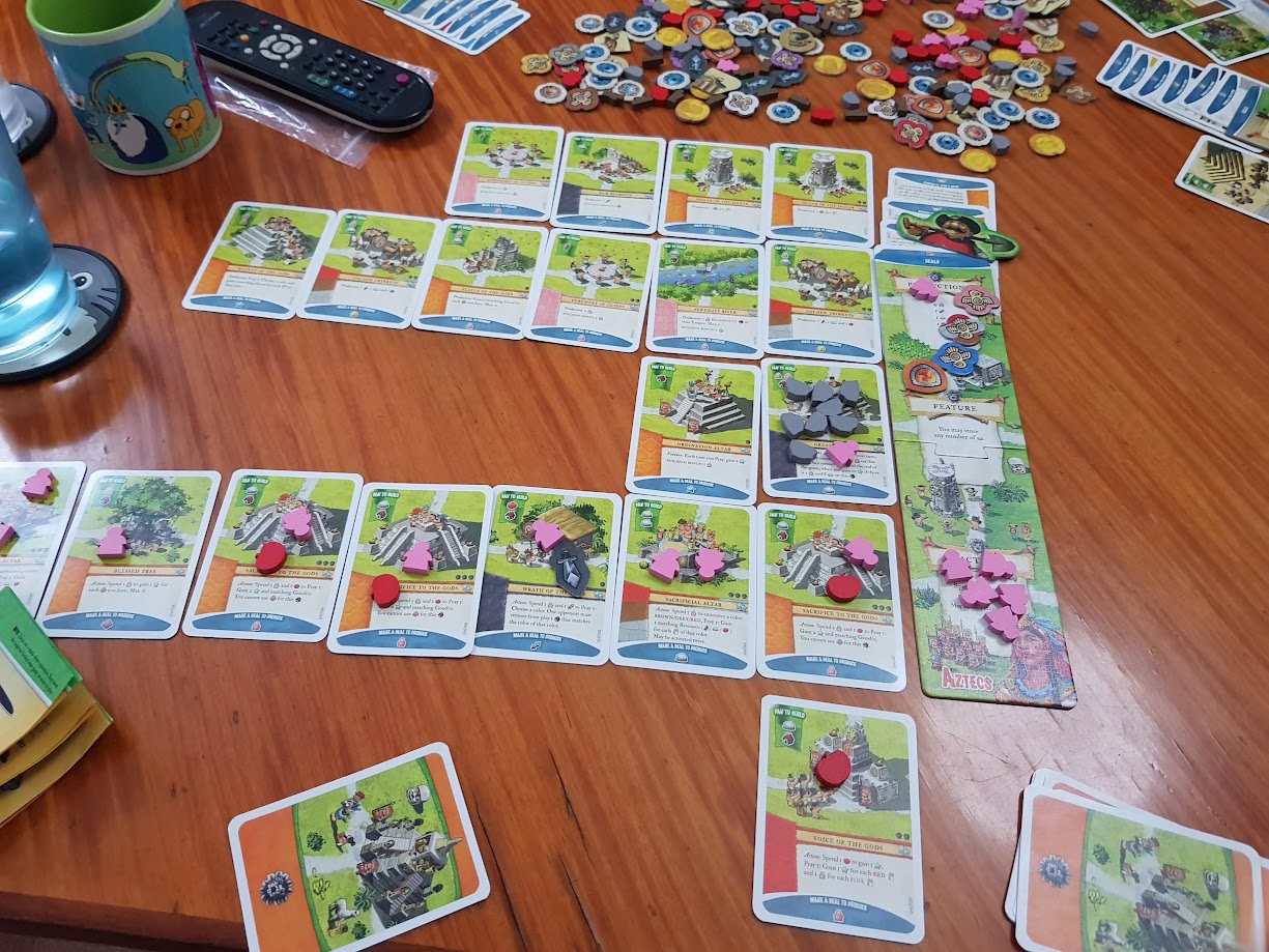 Gameplay photo of the board game Imperial Settlers: Aztecs featuring various components and board state.