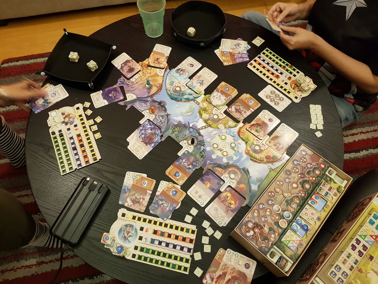 Gameplay photo of the board game Dice Forge: Rebellion featuring various components and board state.