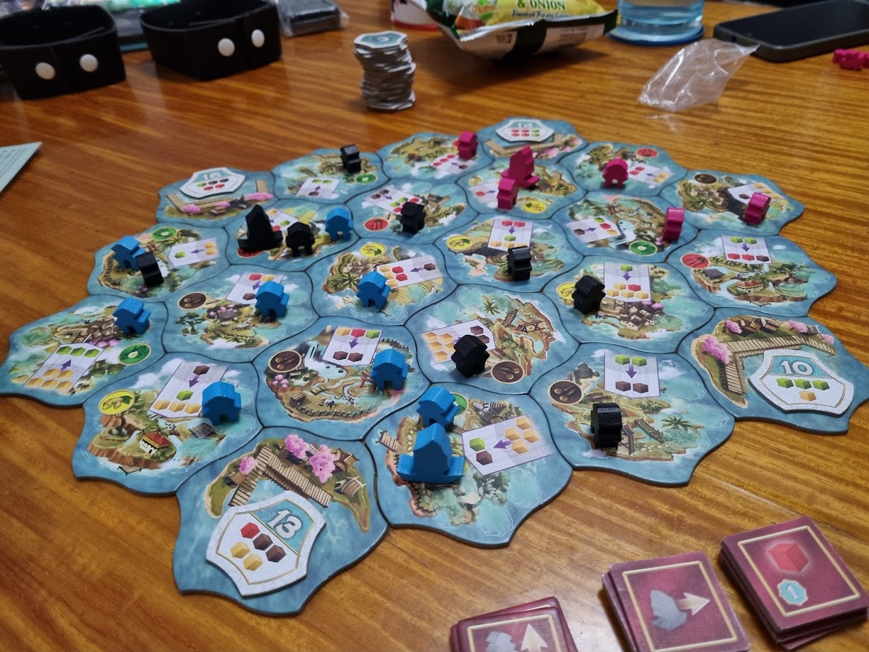 Gameplay photo of the board game Century: Eastern Wonders featuring various components and board state.