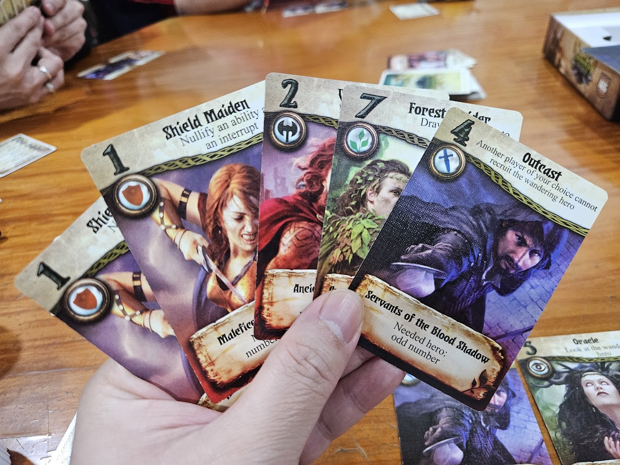 Gameplay photo of the board game Seventh Hero featuring various components and board state.