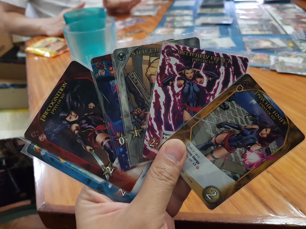 Gameplay photo of the board game Legendary: A Marvel Deck Building Game – X-Men featuring various components and board state.